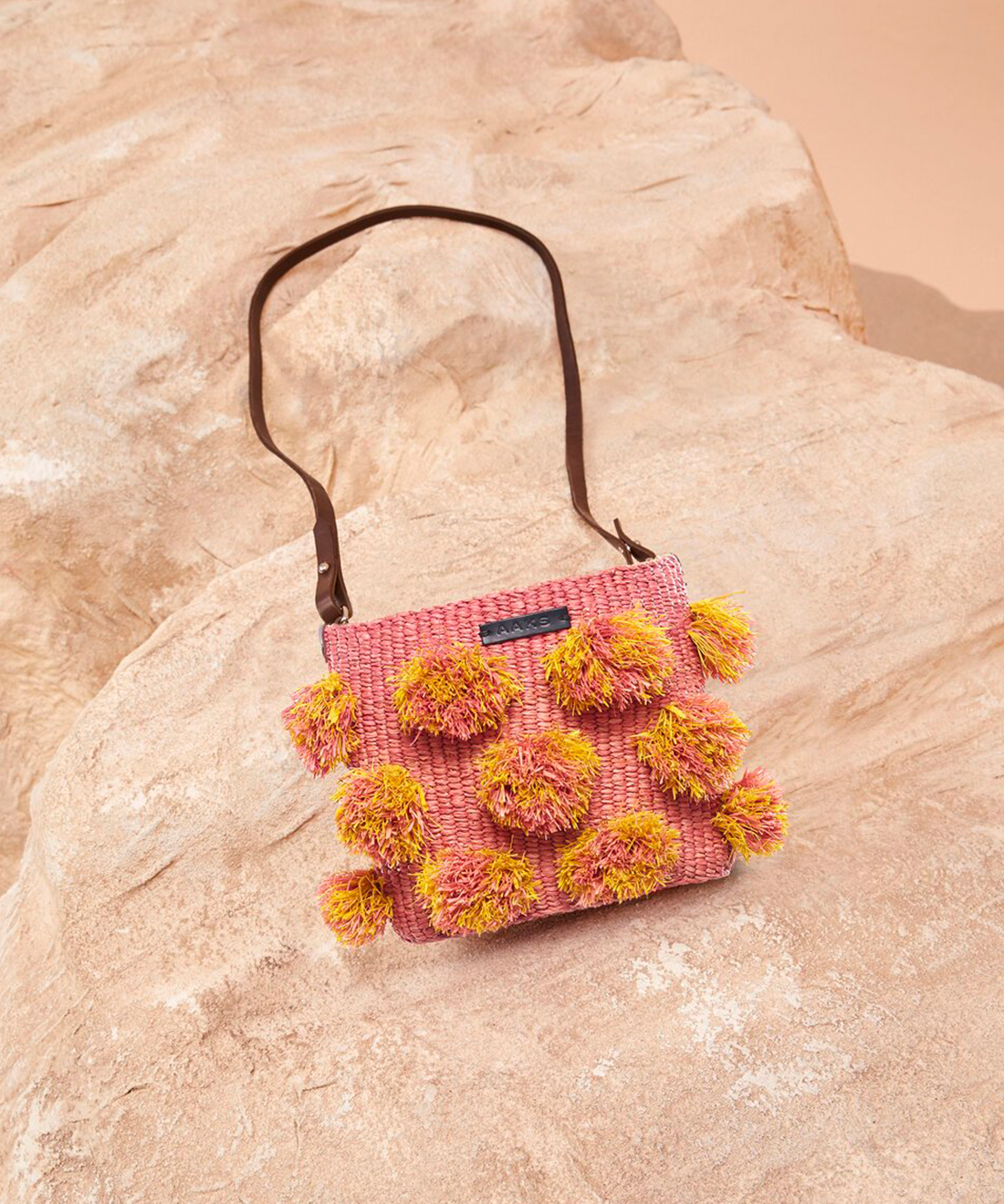 Straw handbag with pom on sale poms